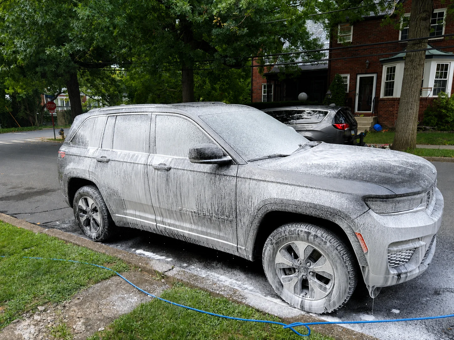 Foam wash stage on a gray SUV
